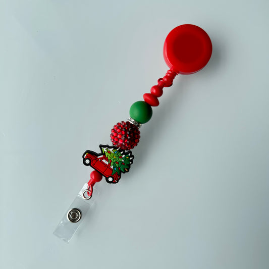 Tree On Car Christmas Badge Reel